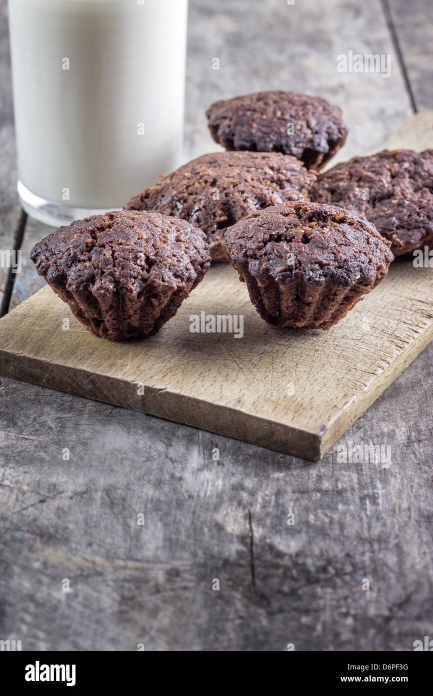cookies and milk on old wooden table Stock Photo