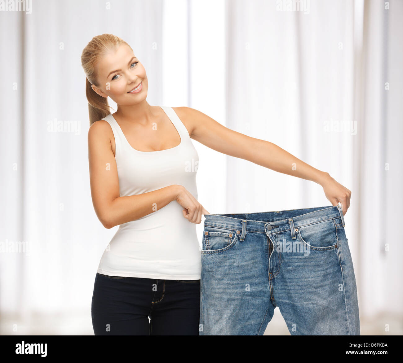sporty-woman-showing-big-pants-stock-photo-alamy