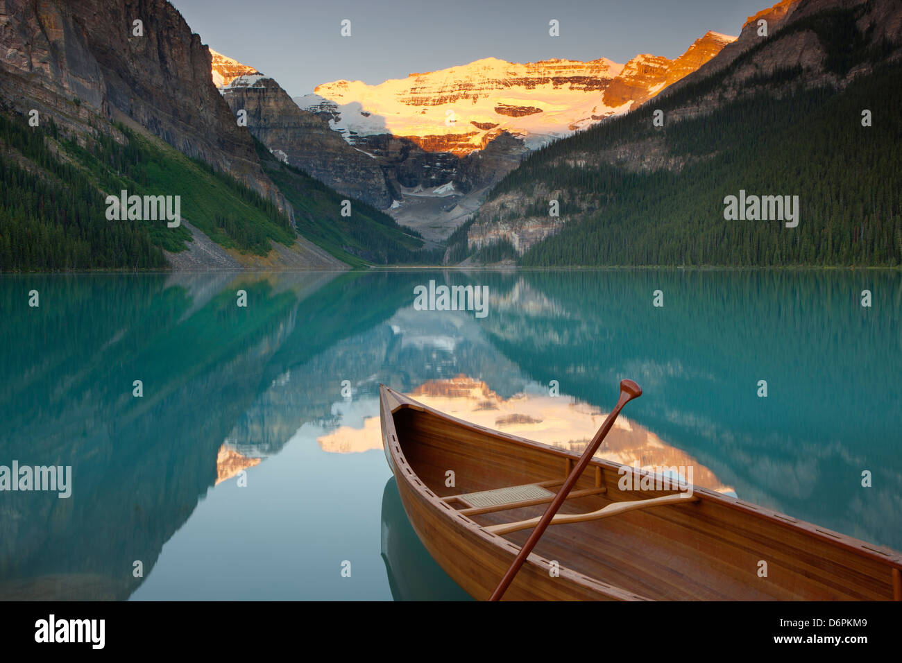 Canoe on Lake Louise at sunrise, Banff National Park, UNESCO World Heritage Site, Alberta, Rocky Mountains, Canada Stock Photo