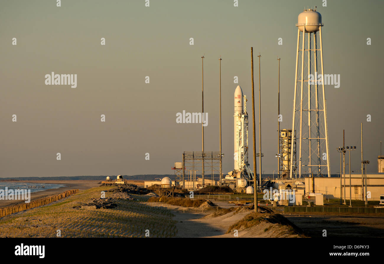 Orbital Sciences Corporation Antares rocket prepares to lift off at sunrise from the Mid-Atlantic Regional Spaceport Launch Pad-0A at the NASA Wallops Flight Facility April 21, 2013 in Wallops, Virginia.  Orbital Sciences Corporation is hoping to become the second commercial operator for rockets to resupply the International Space Station. Stock Photo