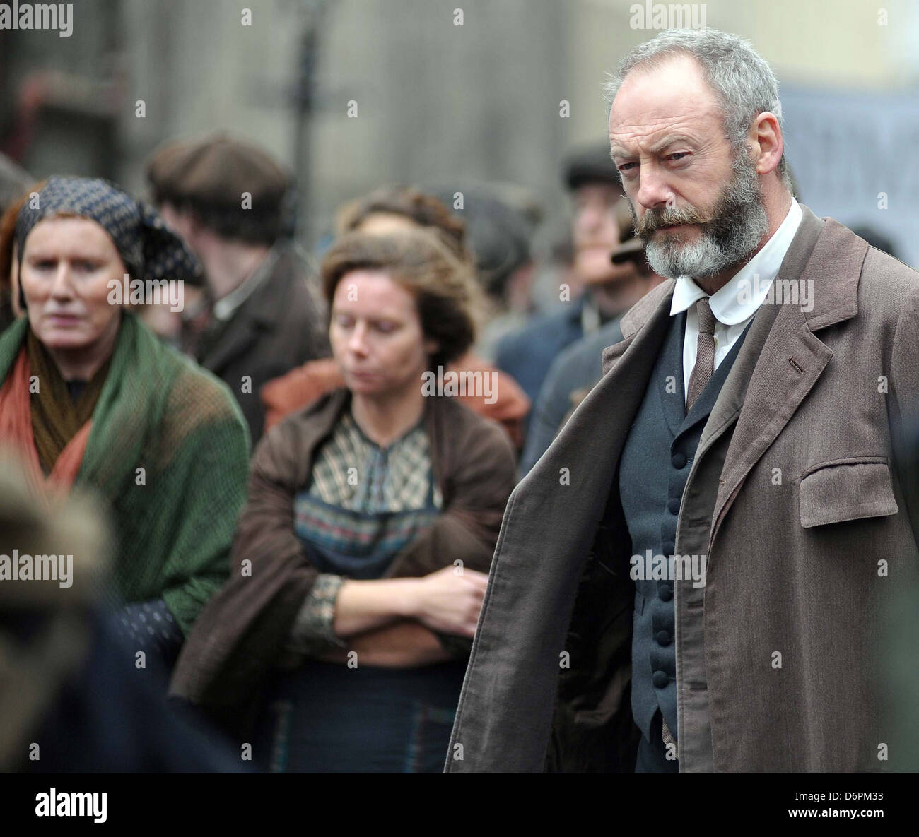 Liam Cunningham on the TV set of 'Titanic: Blood and Steel' shooting on  location in Dublin where he addresses a large group of Stock Photo - Alamy