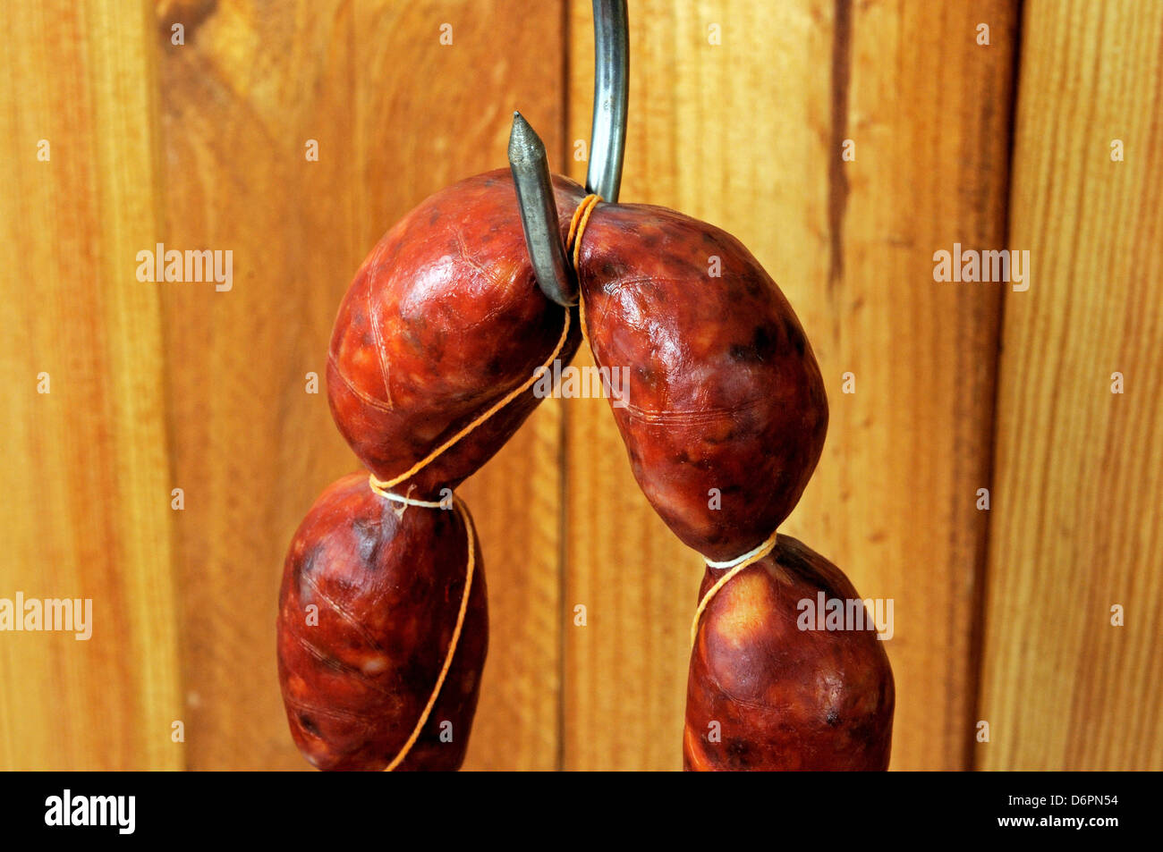 String of Spanish Chorizo sausage hanging from a meat hook, Andalucia, Spain, Western Europe. Stock Photo