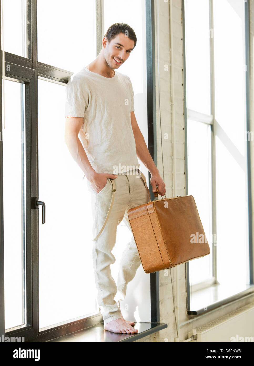 handsome man with retro suitcase Stock Photo - Alamy