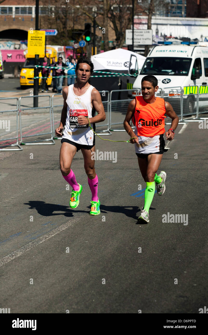 Manuel Garnica from Spain, with his guide runner, competing  in the 2013 London Marathon. Stock Photo