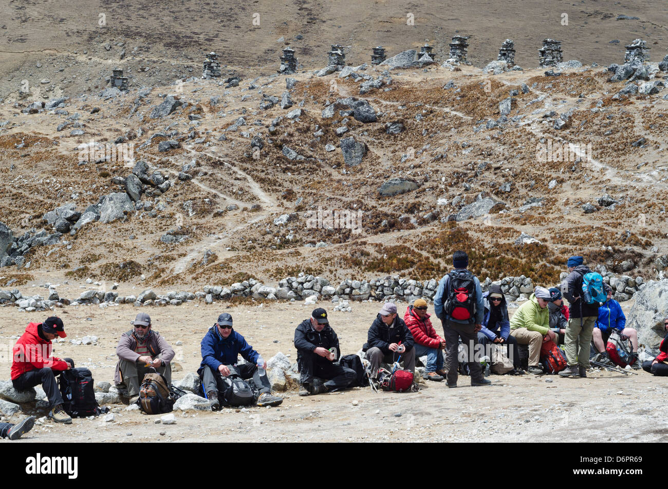 Asia, Nepal, Himalayas, Sagarmatha National Park, Solu Khumbu Everest Region, Unesco, cairn memorial area and resting hikers Stock Photo