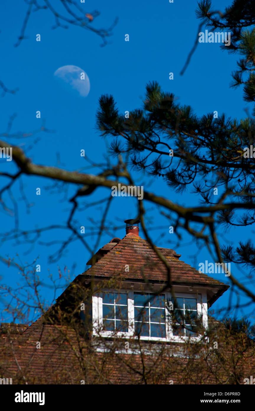 Large house with moon in blue sky Stock Photo - Alamy
