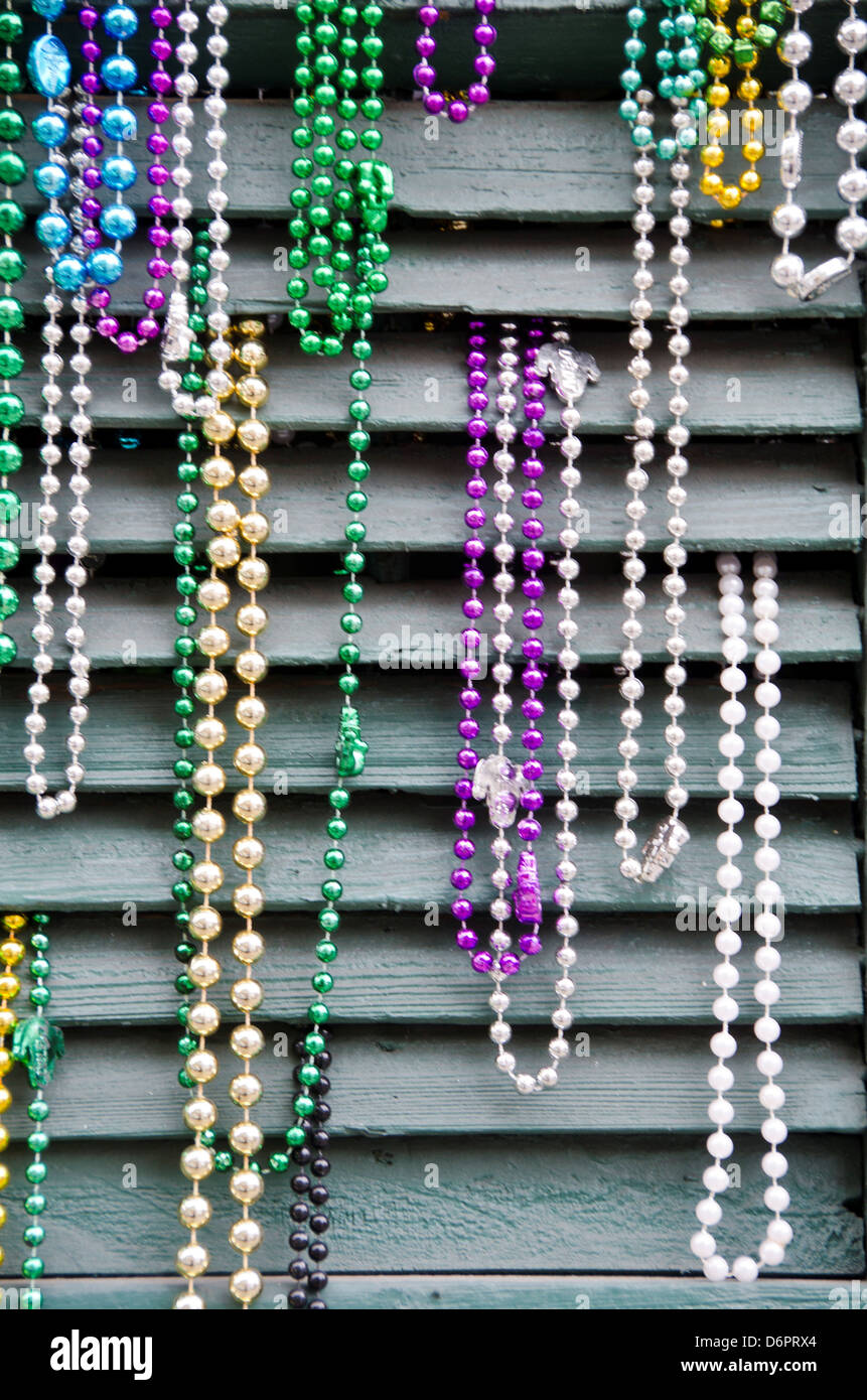 Mardi Gras beads hanging on a storm shutter, New Orleans, Louisiana, USA  Stock Photo - Alamy