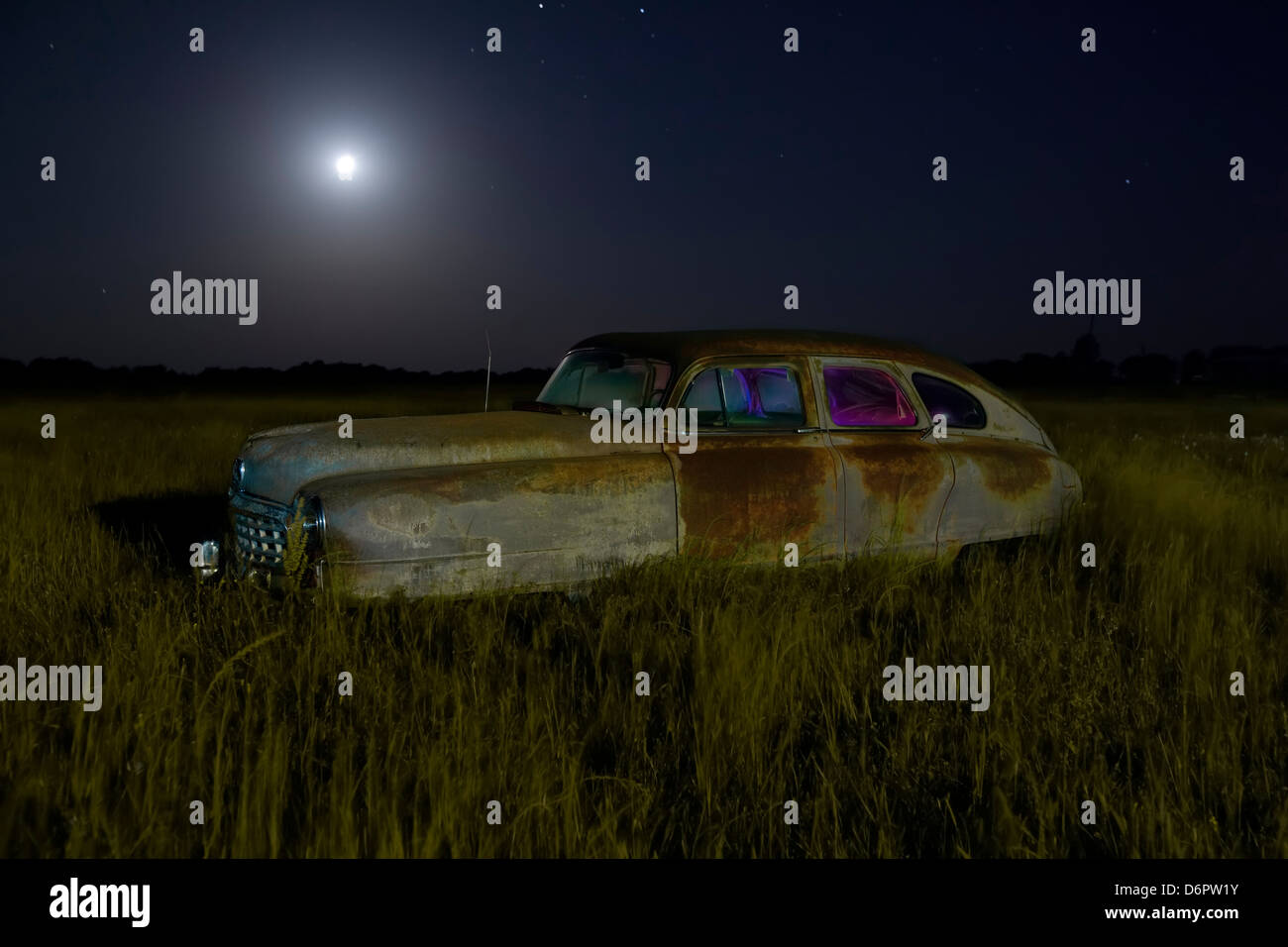 Abandoned vintage car in a field at night, USA Stock Photo - Alamy