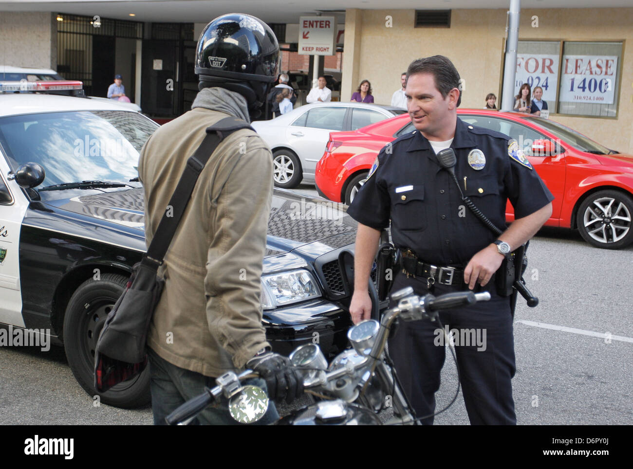 Keanu Reeves speaking with a Beverly Hills Police officer about the  accident A woman parking on Roxbury Drive backed her Stock Photo - Alamy