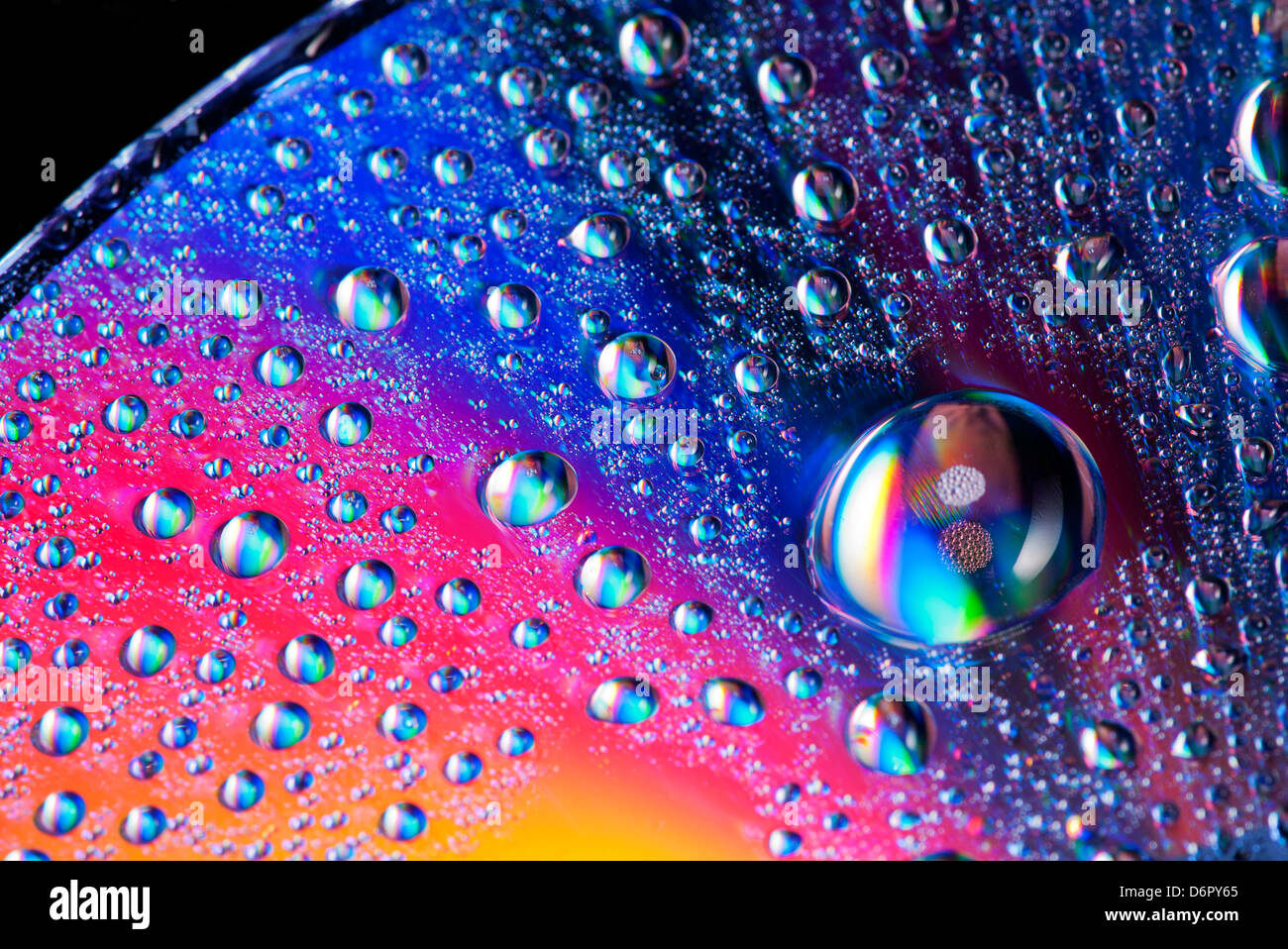 close up of water droplets on a cd, dvd disk Stock Photo - Alamy