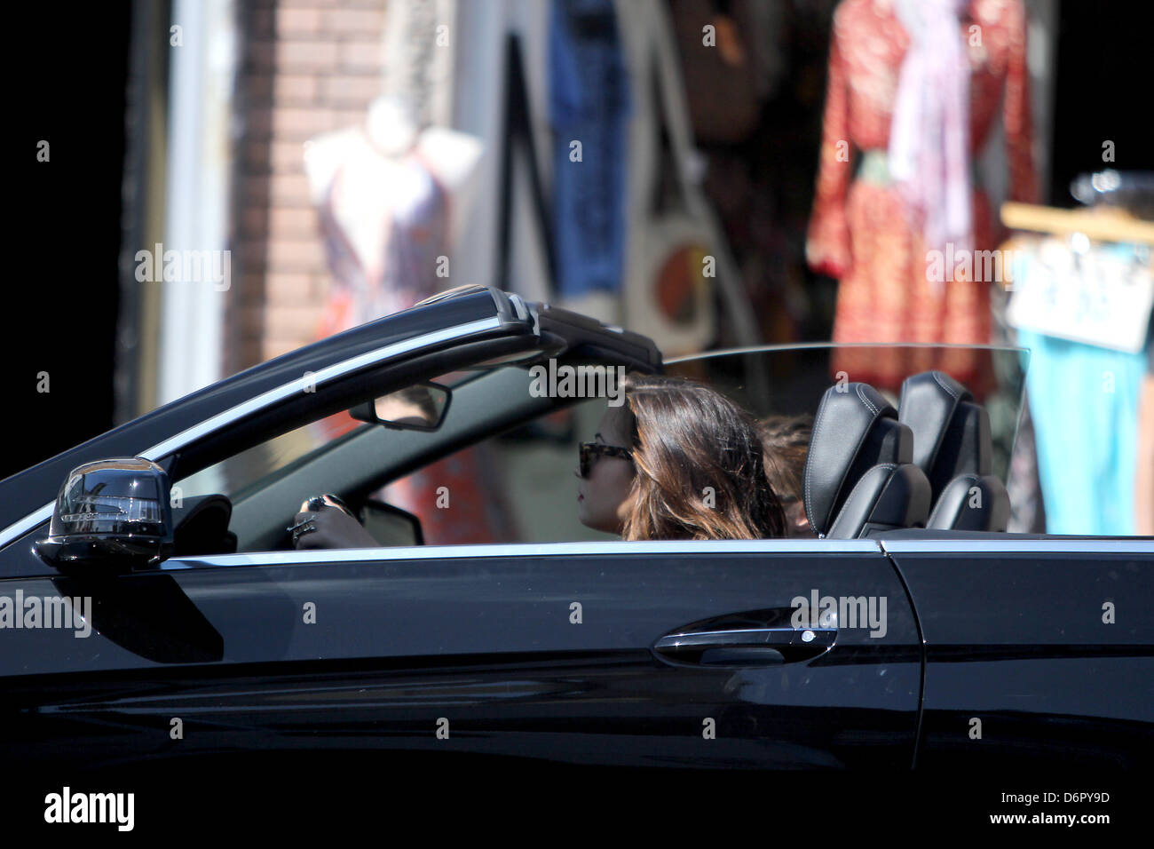 Demi Lovato driving in her black convertible after shopping at Slow  Boutique on Melrose Avenue Los Angeles, California Stock Photo - Alamy