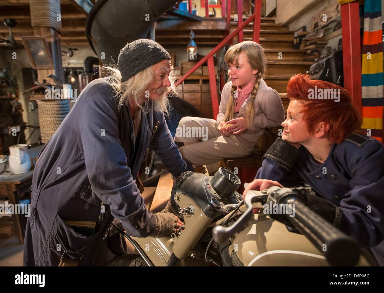 Actors ler Kristoffer Joner (Doktor Proktor, L), Emily Glaister (Lise, C) and Eilif H. Noraker (Bulle) talks on the movie set of the German-Norwegian co-production 'Dokto Proktors Pupspulver' (English translation Doctor Proctor's Fart Powder) in Erfurt, Germany, 22 April 2013. Jo Nesbos well-loved children's book about the crazy professor Doctor Proctor will be filmed in Erfurt until 07 May 2013 and then in Oslo, Norway. It should come to cinemas at the beginning of next year. Photo: MICHAEL REICHEL Stock Photo