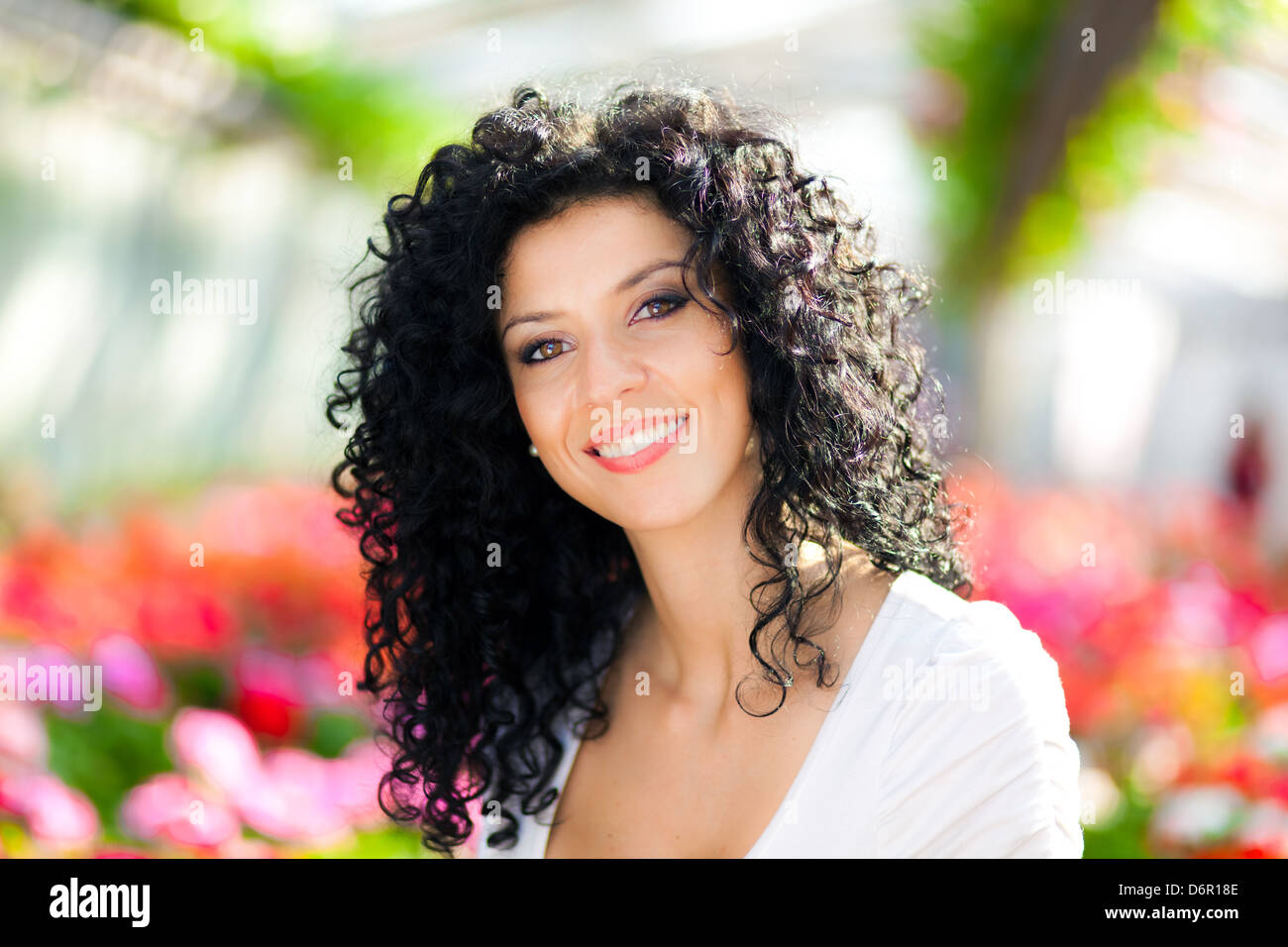 Portrait of a beautiful woman in a greenhouse Stock Photo - Alamy