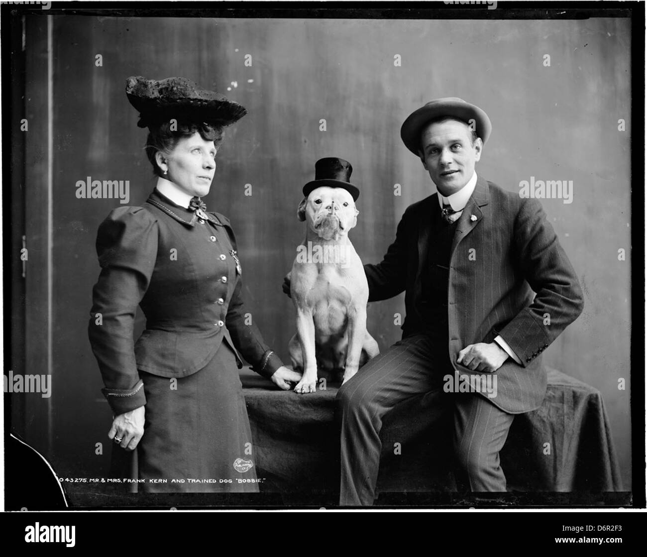 Mr. and Mrs. Frank Kern with their trained dog Bobbie in a photograph ...