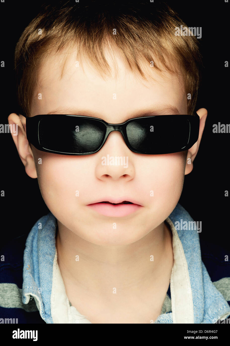 Studio Portrait of a boy with sunglasses Stock Photo
