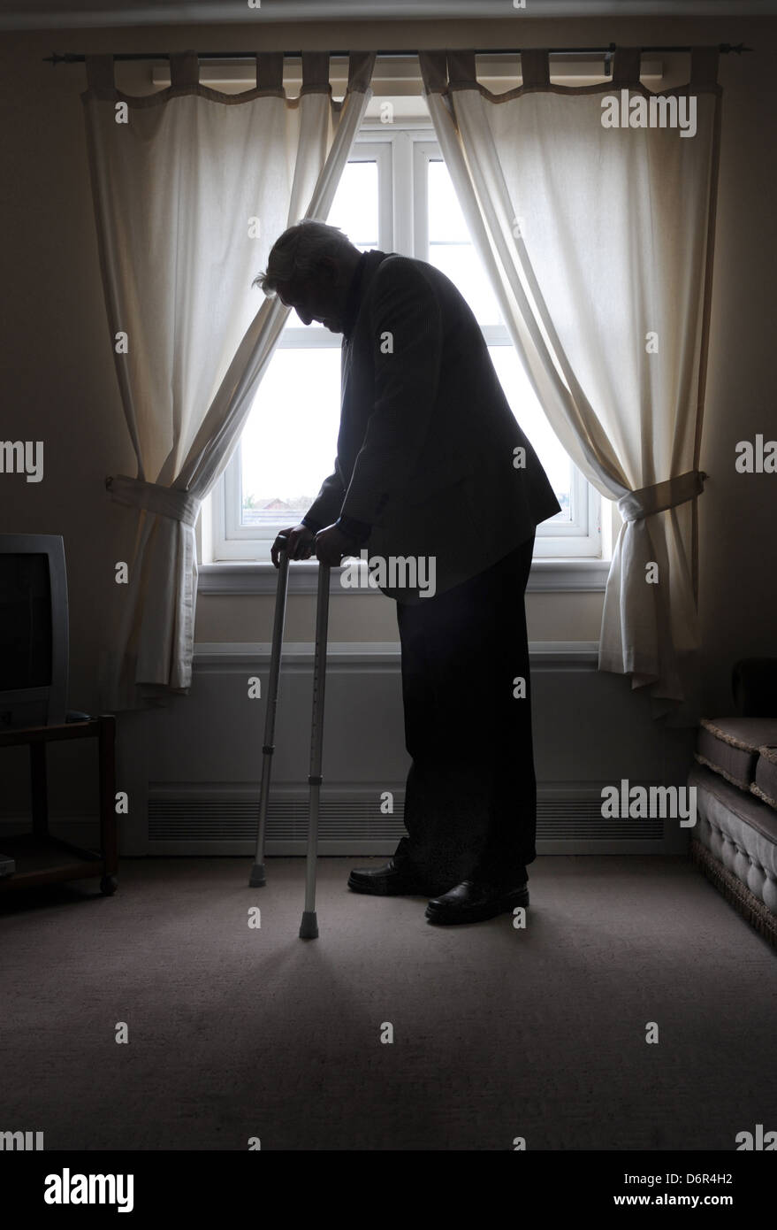 ELDERLY MAN WITH WALKING STICKS RE RETIREMENT DEPRESSION OLD AGE OAPS CAREHOME CARE INFIRM LONELY BENEFITS NURSING DISABILTY UK Stock Photo