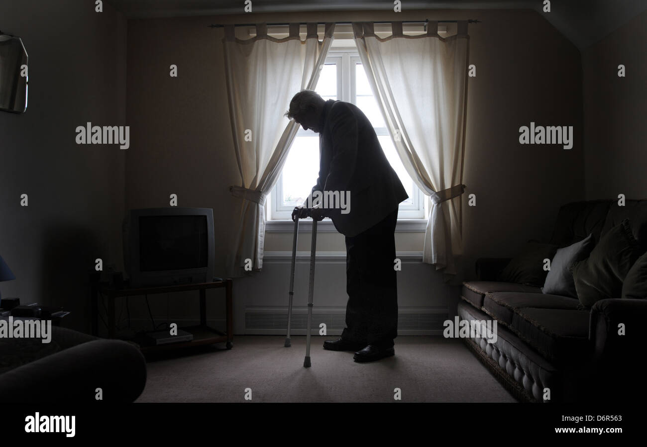 ELDERLY MAN WITH WALKING STICKS RE LONELY DEPRESSION OLD AGE OAPS CAREHOME CARE INFIRM WELFARE BENEFITS NURSING DISABILTY Stock Photo