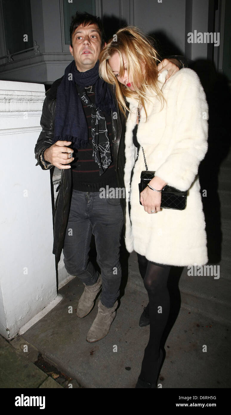 Newly engaged Jamie Hince and Kate Moss leave a private residence in the early hours of the morning looking a little worse for Stock Photo