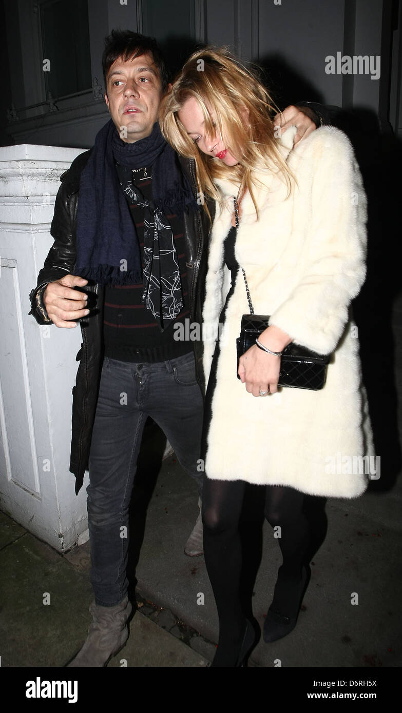 Newly engaged Jamie Hince and Kate Moss leave a private residence in the early hours of the morning looking a little worse for Stock Photo