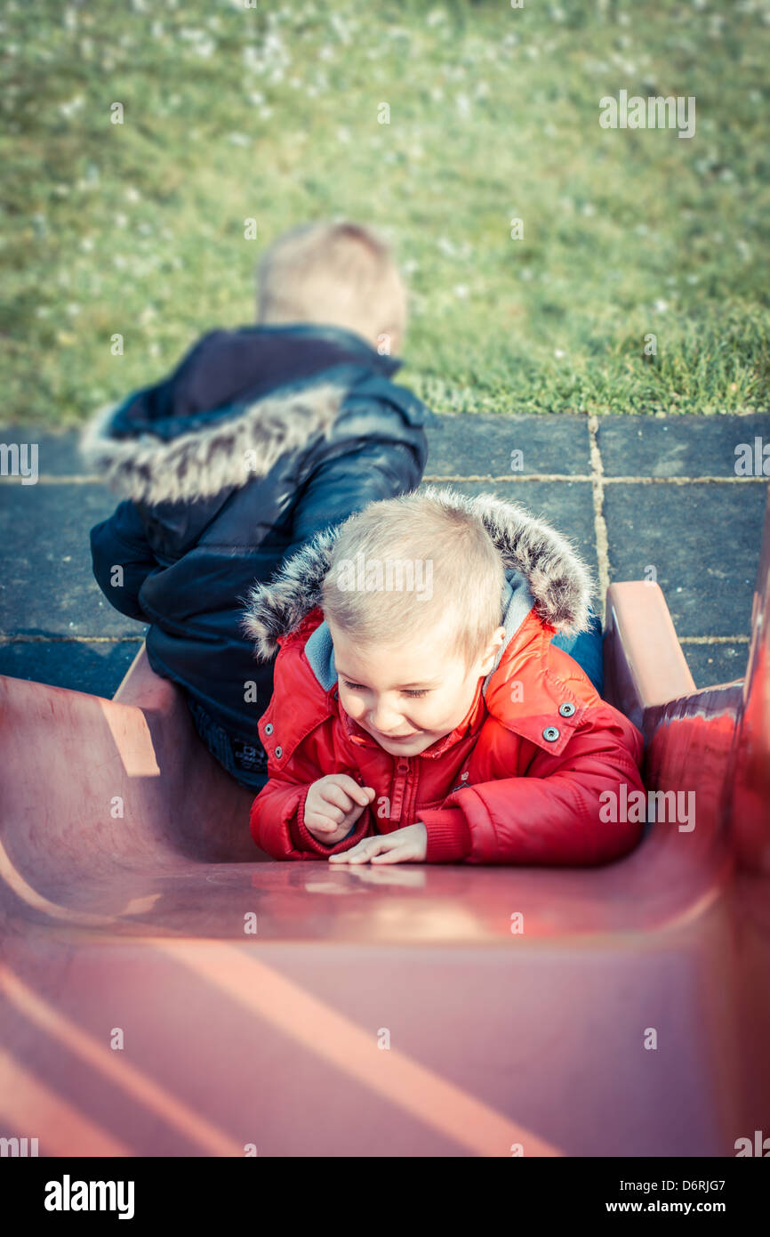 Two boys (5-7) in playground, France. Stock Photo