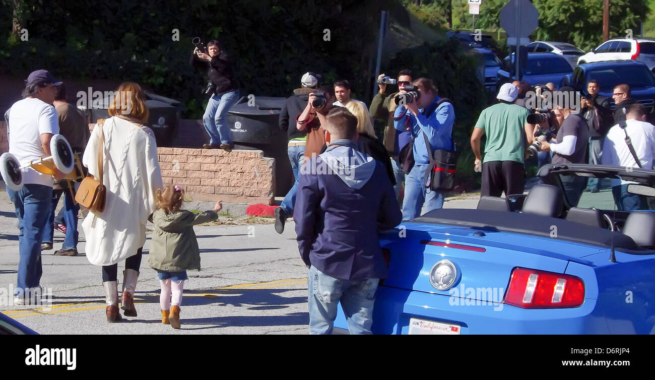 The LA paparazzi ascend on Coldwater Canyon Park in Beverly Hills as Jessica Alba and her family are leaving. Alba enjoyed some Stock Photo