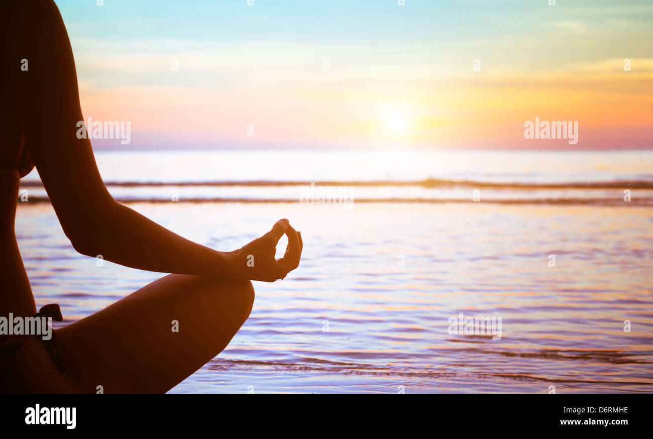 serenity and yoga practicing at sunset, meditation Stock Photo