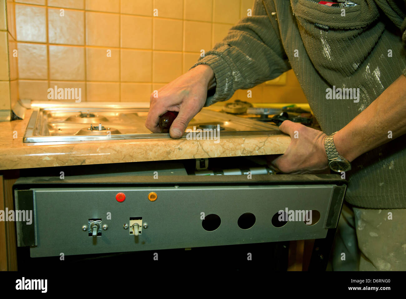 Poznan, Poland, plumber repairing a gas stove Stock Photo Alamy