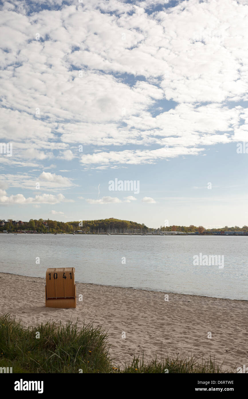 Eckernfoerde, Germany, a lone beach chair on the beach of the Baltic Sea Stock Photo