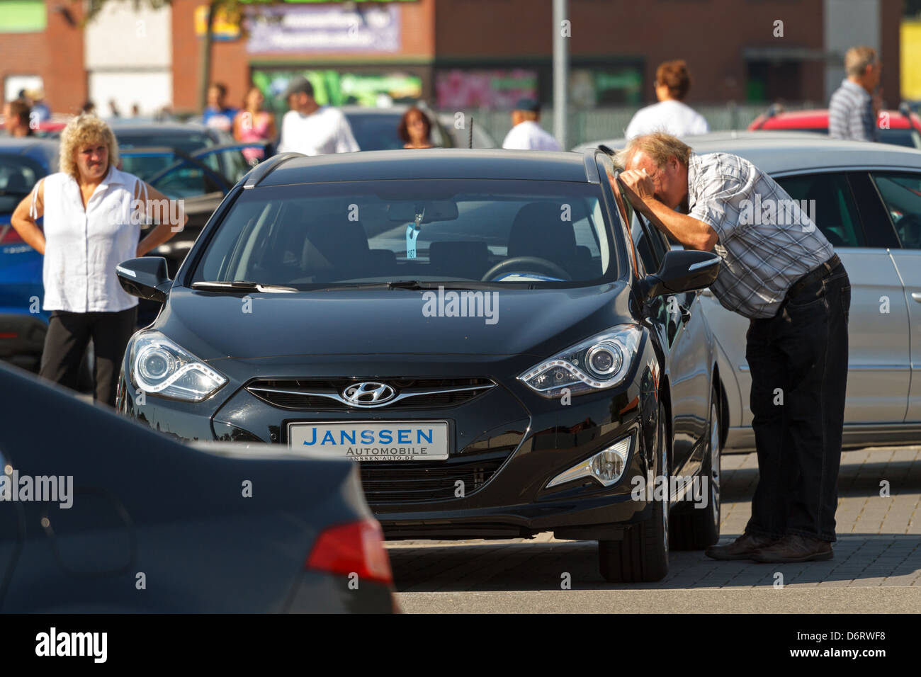 Aurich, Germany, visitors look at a Hyundai in the first Auricher Gebrauchtwagentag Stock Photo