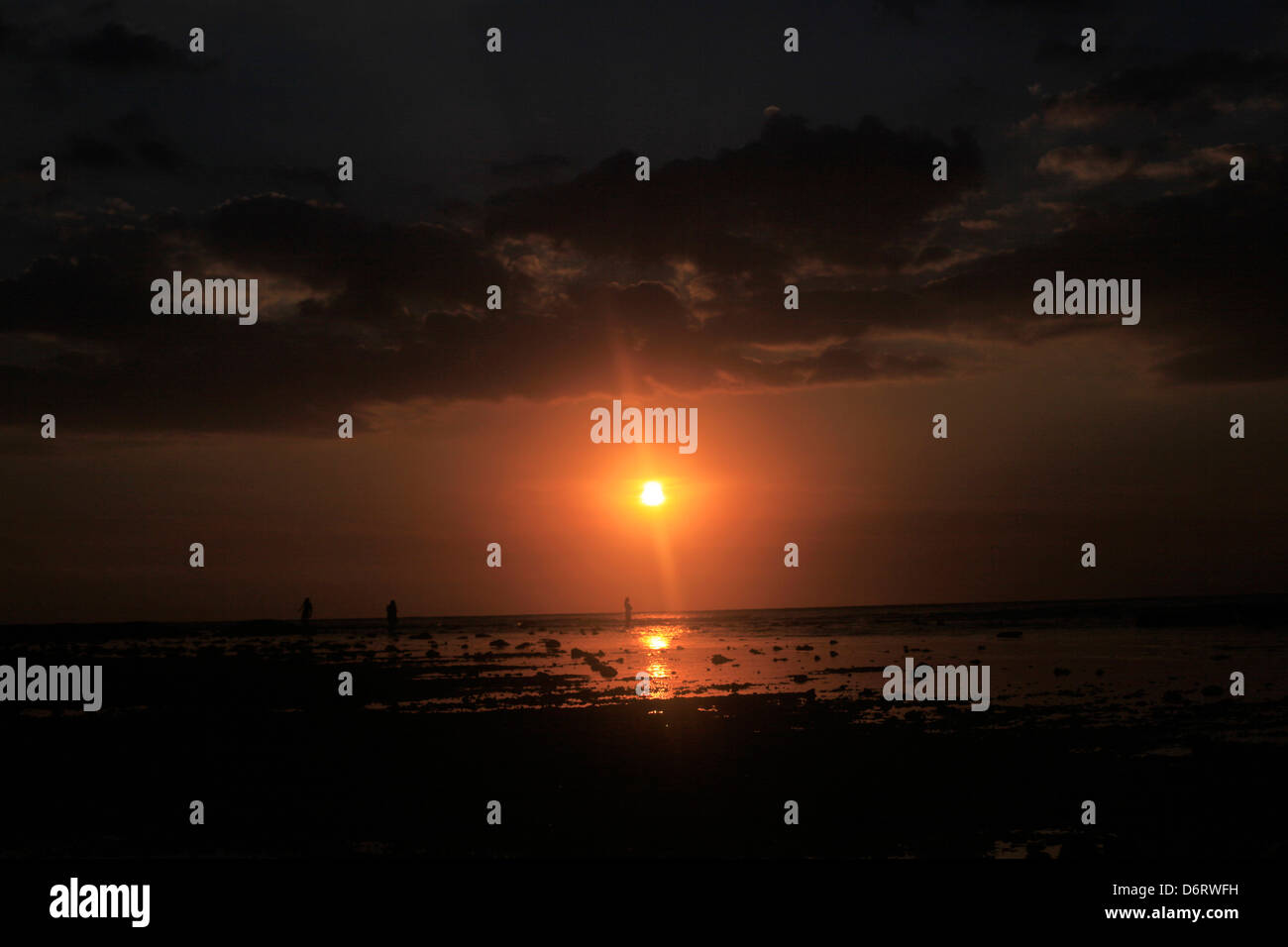 A spectacular sunset is seen from Gili Trawangan  looking towards Bali, indonesia Stock Photo