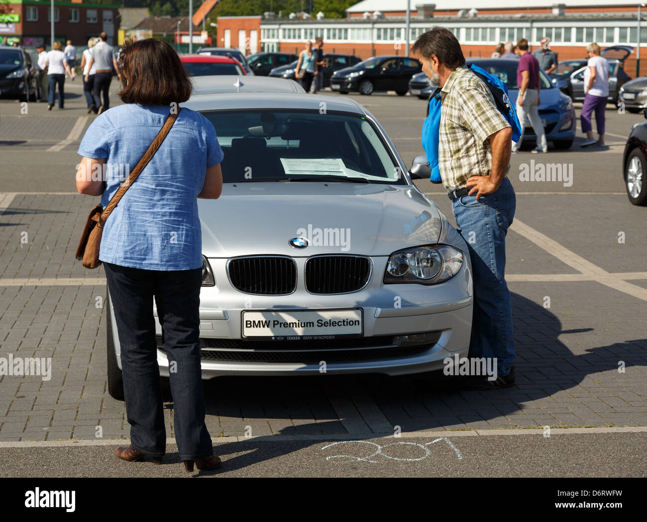 Aurich, Germany, Visitors look at a BMW on the first Auricher Gebrauchtwagentag Stock Photo