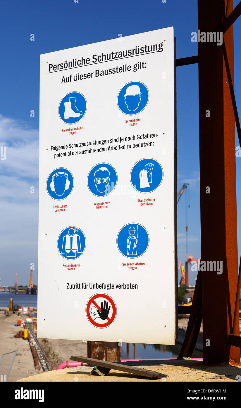 Emden, Germany, Schutzausruestung sign with instructions for personal / work site safety lock Nesserlander Stock Photo