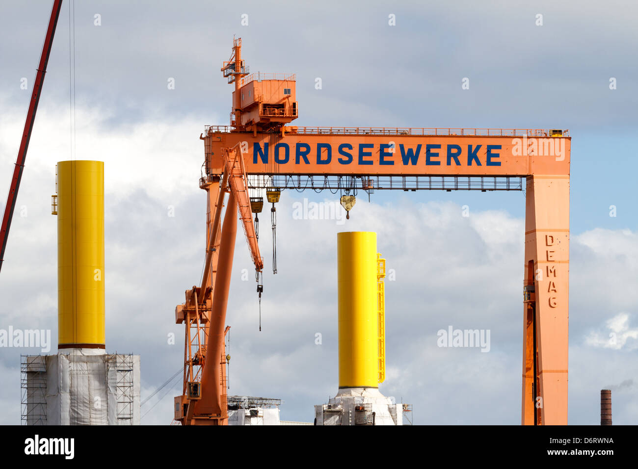 Emden, Germany, overlooking the North Sea SIAG works with foundations for offshore wind turbines Stock Photo