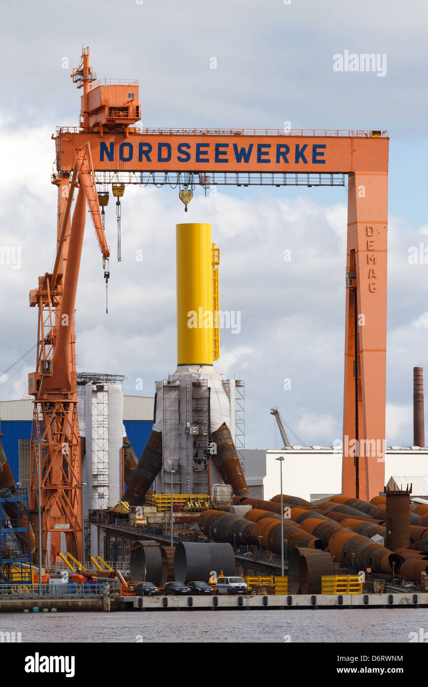 Emden, Germany, overlooking the North Sea SIAG works with foundations for offshore wind turbines Stock Photo
