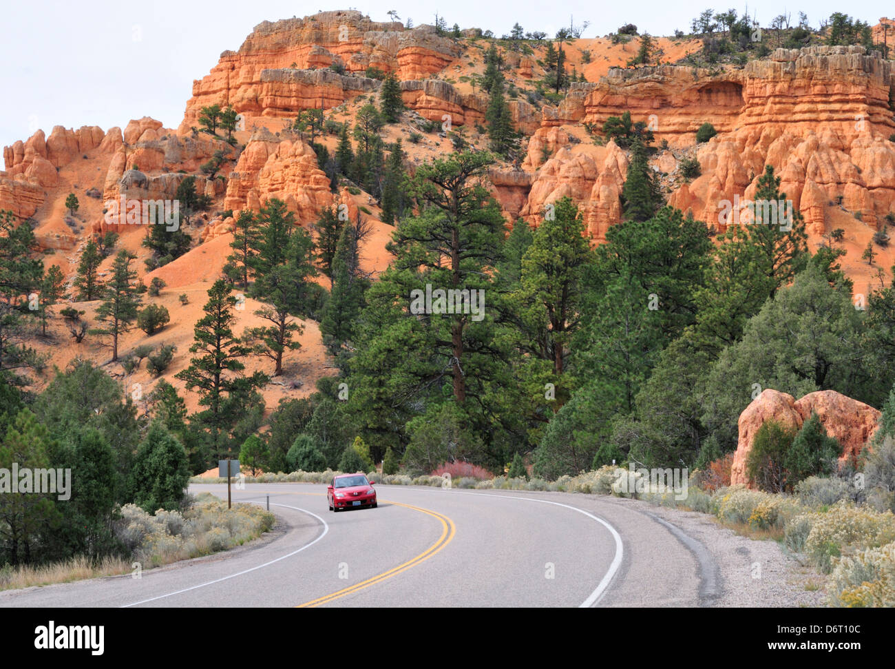 Car riding on Utah Route 12 through Red Canyon Stock Photo