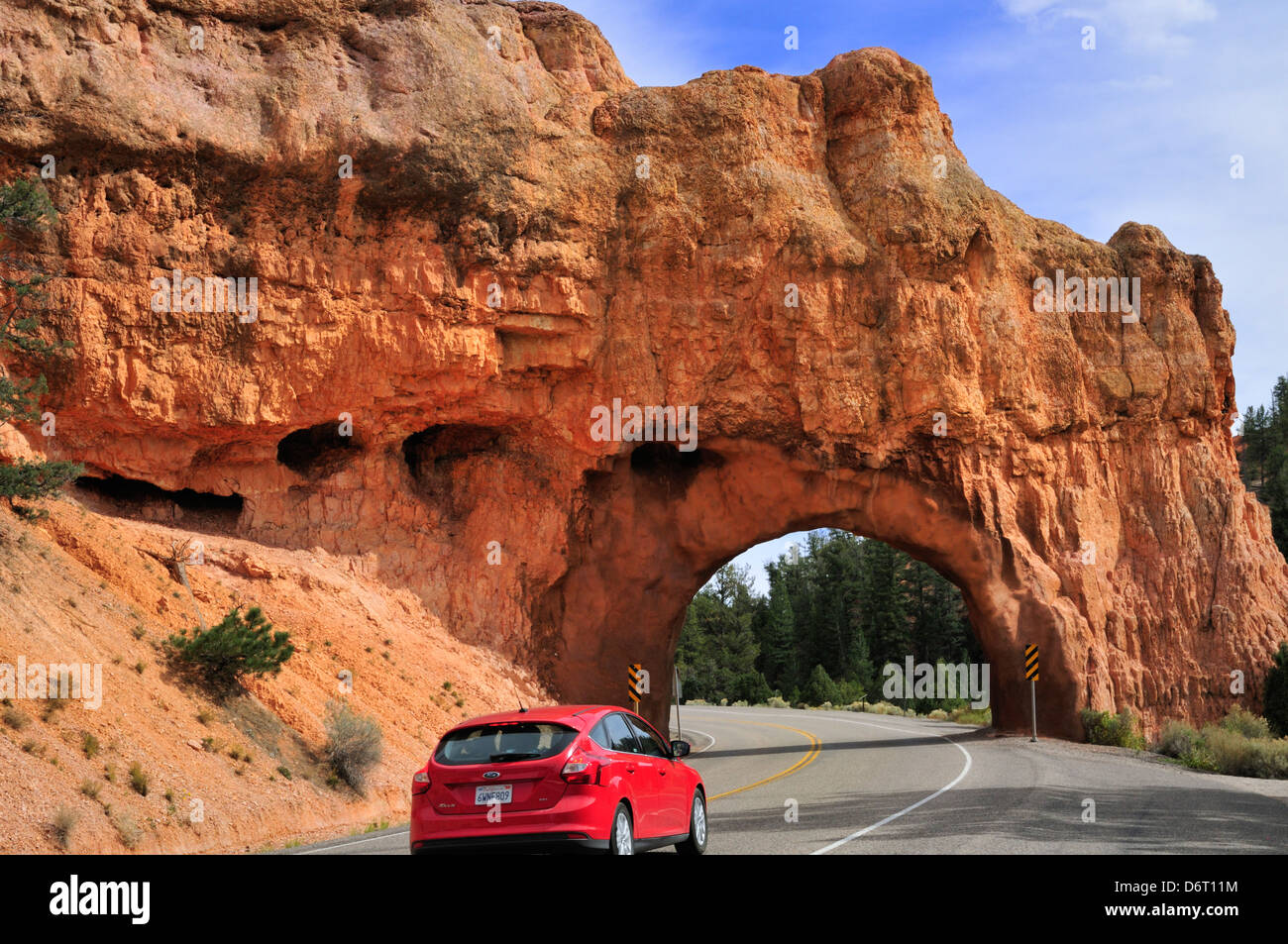 Car approaching a tunnel in Red Canyon, Utah Route 12 Stock Photo