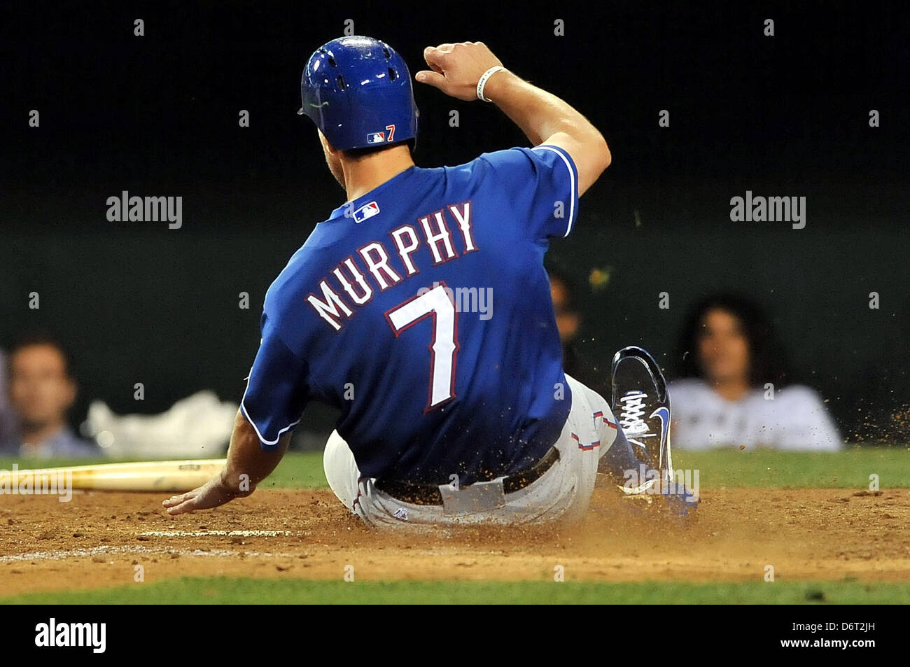 Anaheim, California, USA. 22nd April, 2013. Texas' David Murphy #7 slides safely at home plate to score a run during the Major League Baseball game between the Texas Rangers and the Los Angeles Angels of Anaheim at Angel Stadium in Anaheim, California. Josh Thompson/Cal Sport Media/Alamy Live News Stock Photo