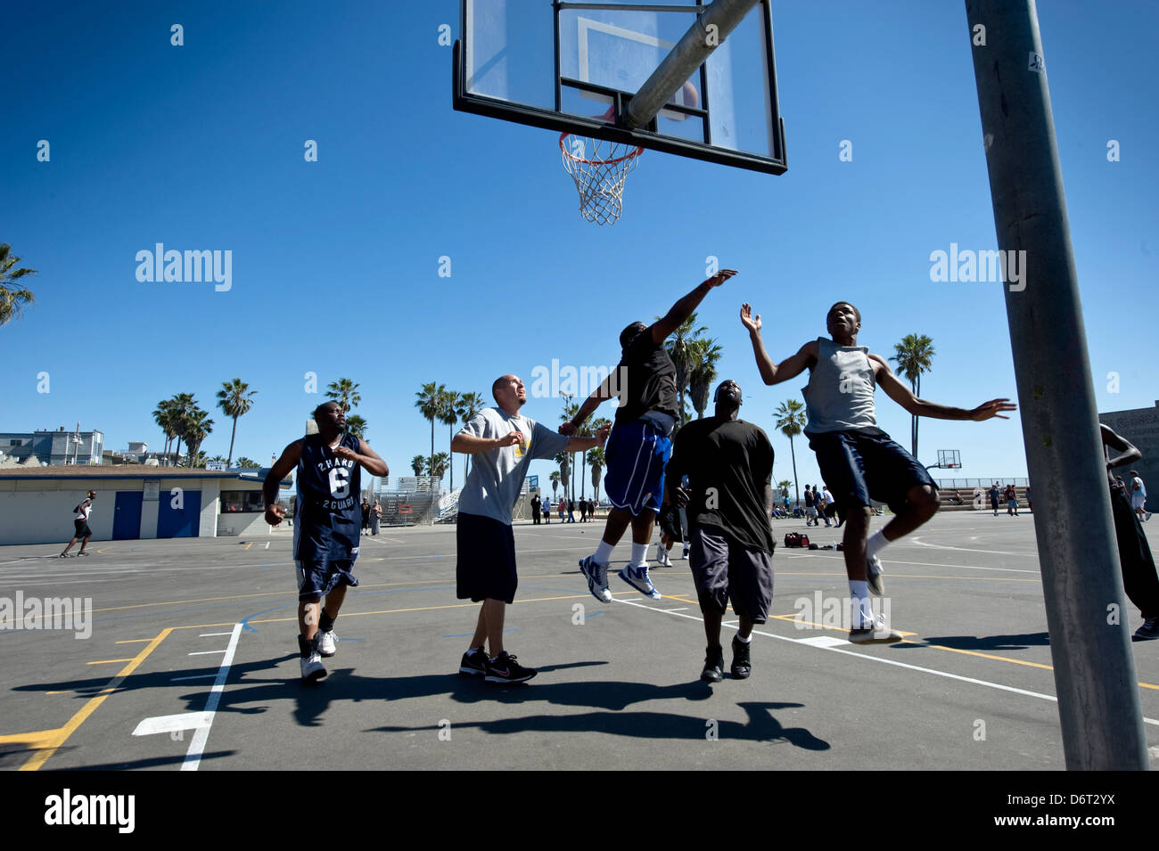Venice Beach, Santa Monica, California, USA, April 10, 2013: a group of men play basketball on a public court Stock Photo