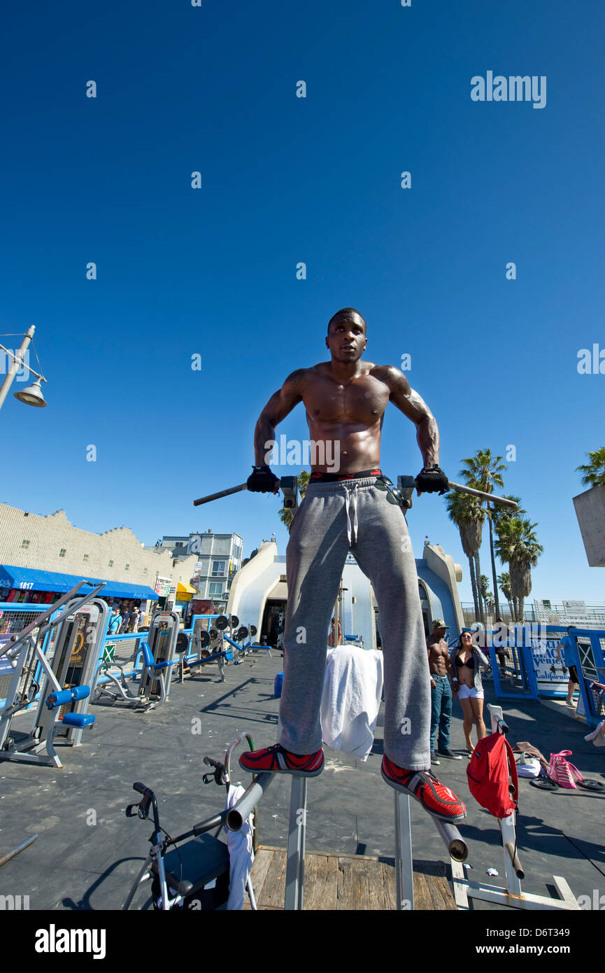 Venice Beach, Santa Monica, California, USA a bodybuilder exercises