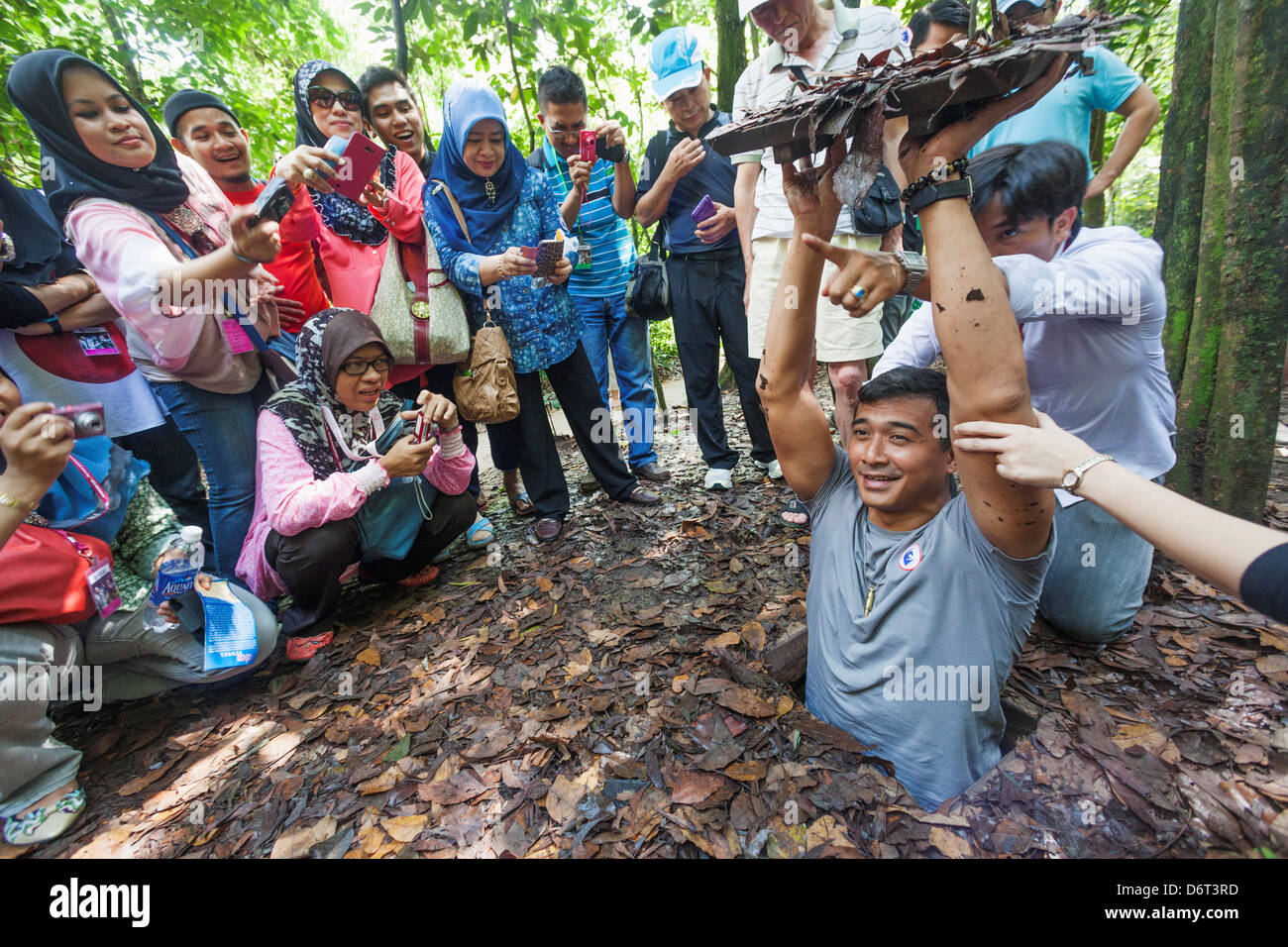 Vietnam, Ho Chi Minh City, Cu Chi Tunnels, Tourists Emerging from