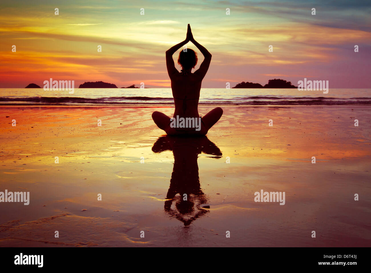 yoga on the beach Stock Photo