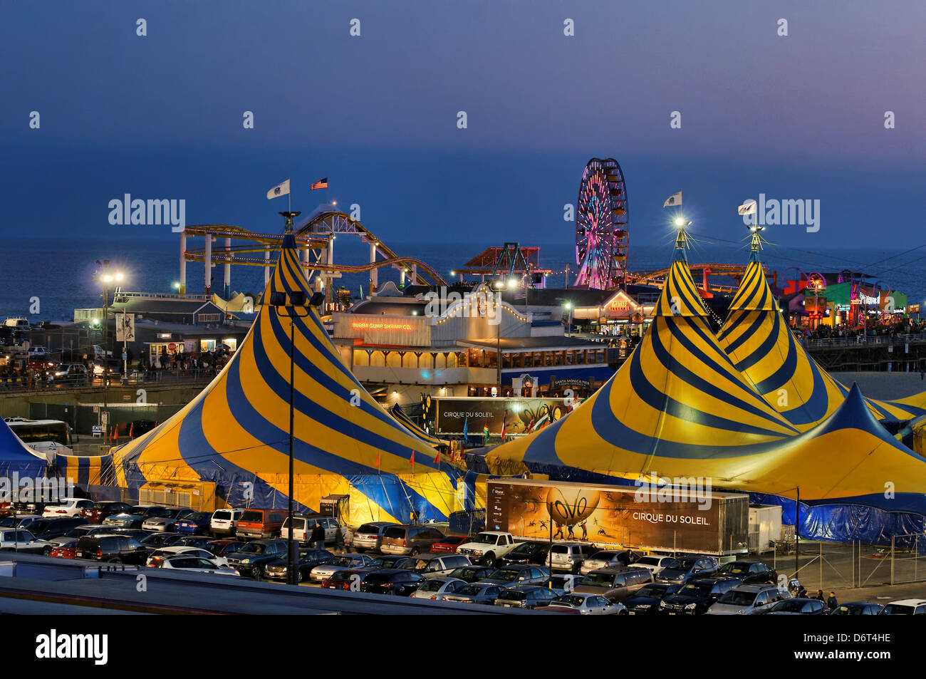 USA California Santa Monica Striking blue yellow tent tops Cirque du Soleil adorning Santa Monica Beach next Santa Monica Pier Stock Photo