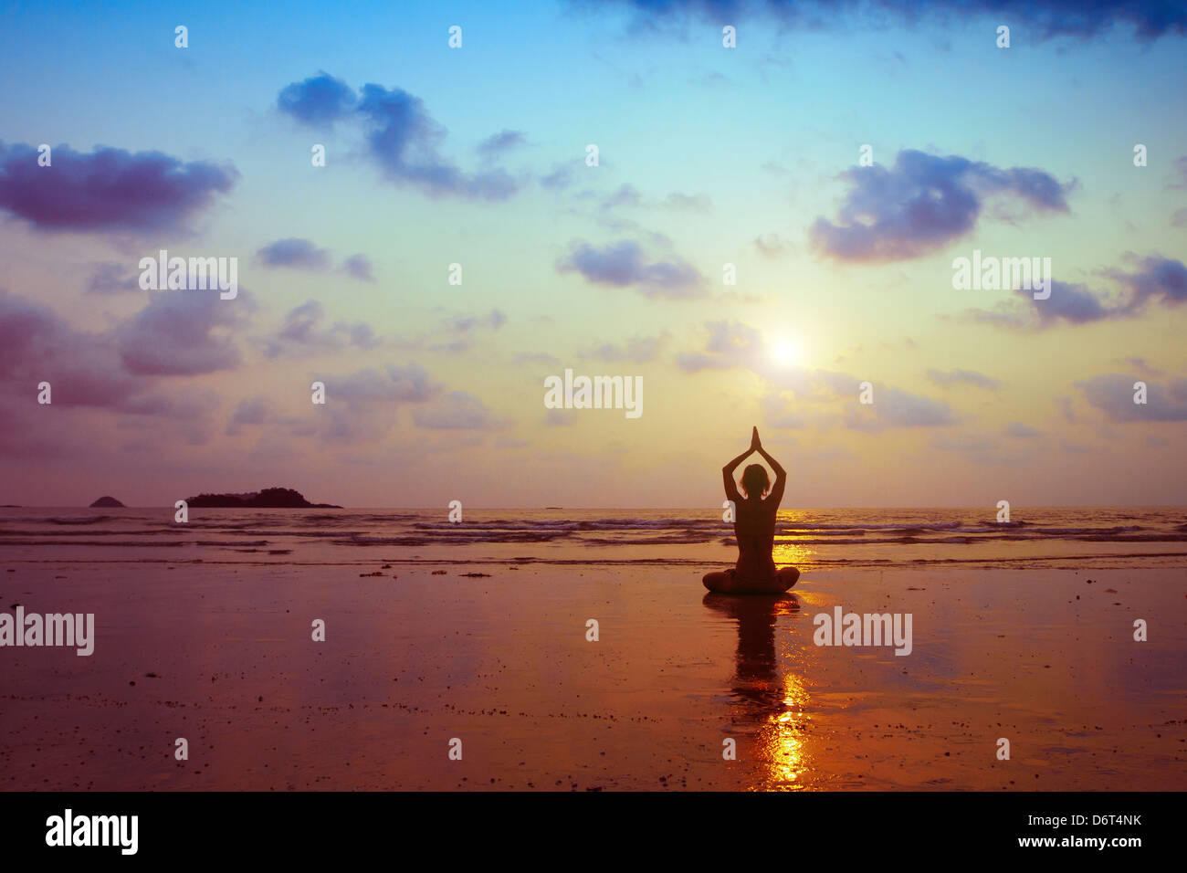 breathing exercises, silhouette of woman practicing yoga Stock Photo