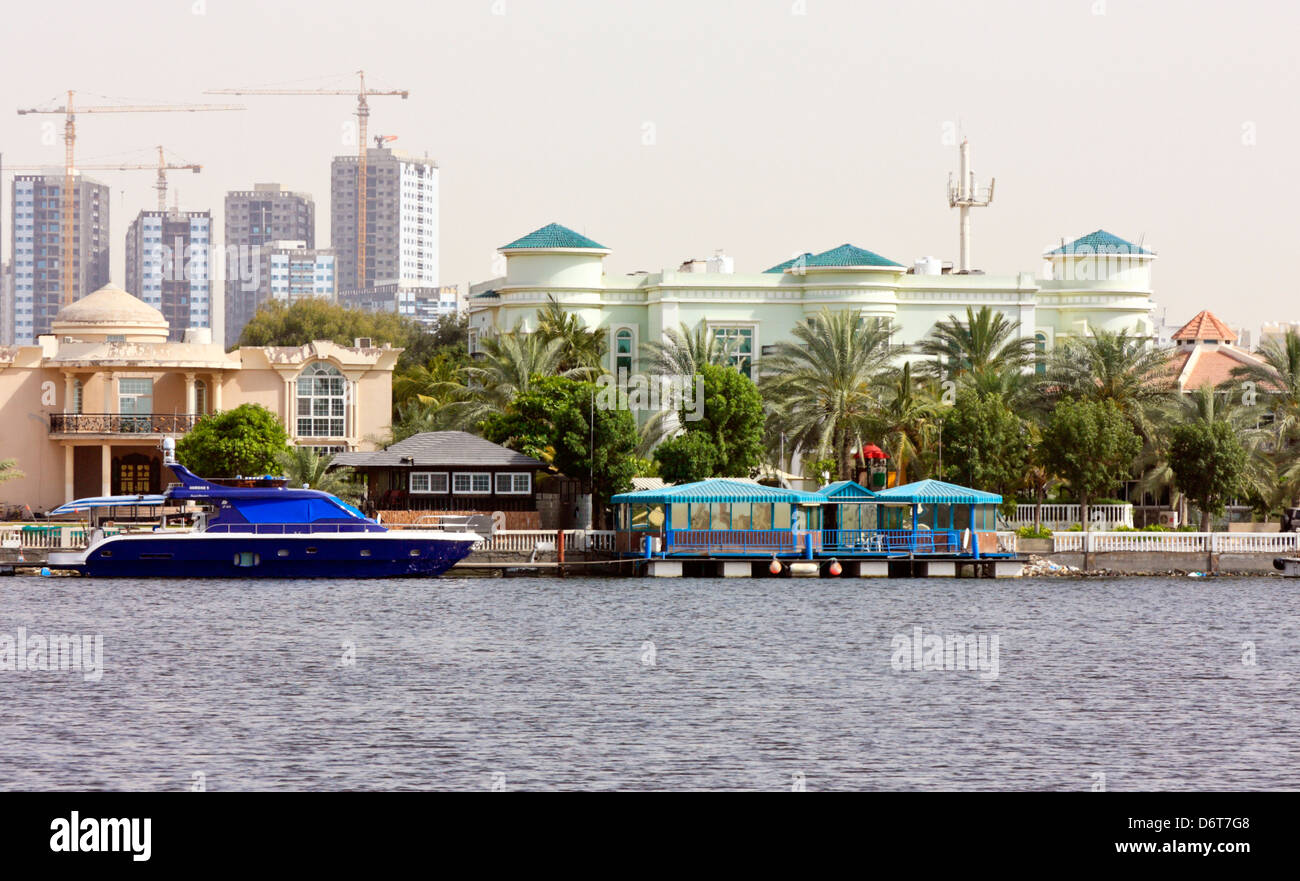 Residential Area with Jetty and Motor Yacht, Ajman, United Arab Emirates Stock Photo