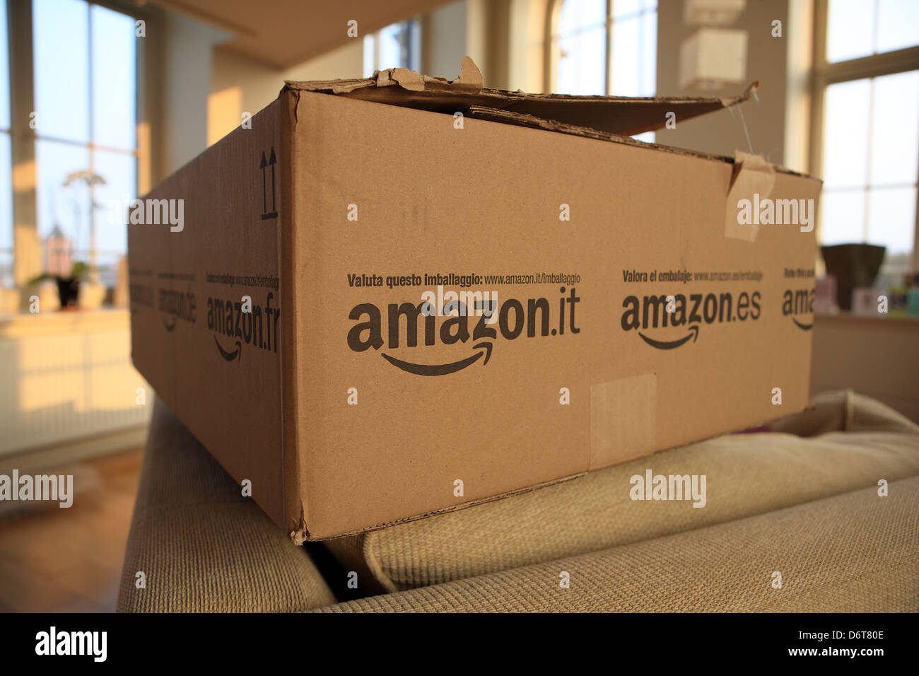 Amazon delivery to the home. Large Amazon box in lounge showing the ease of internet shopping from online retailers Stock Photo
