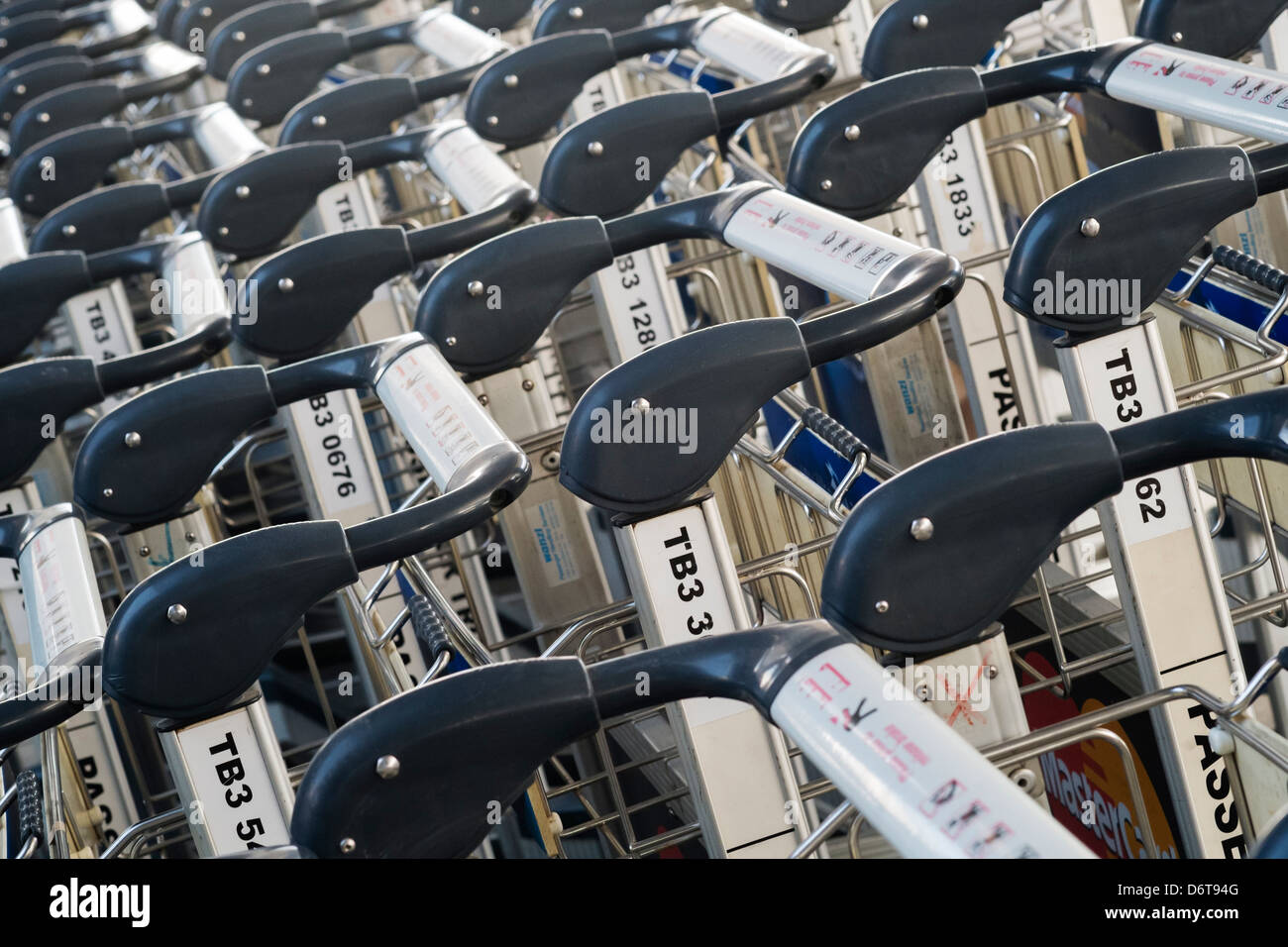 Many luggage carts lined up at an airport Stock Photo