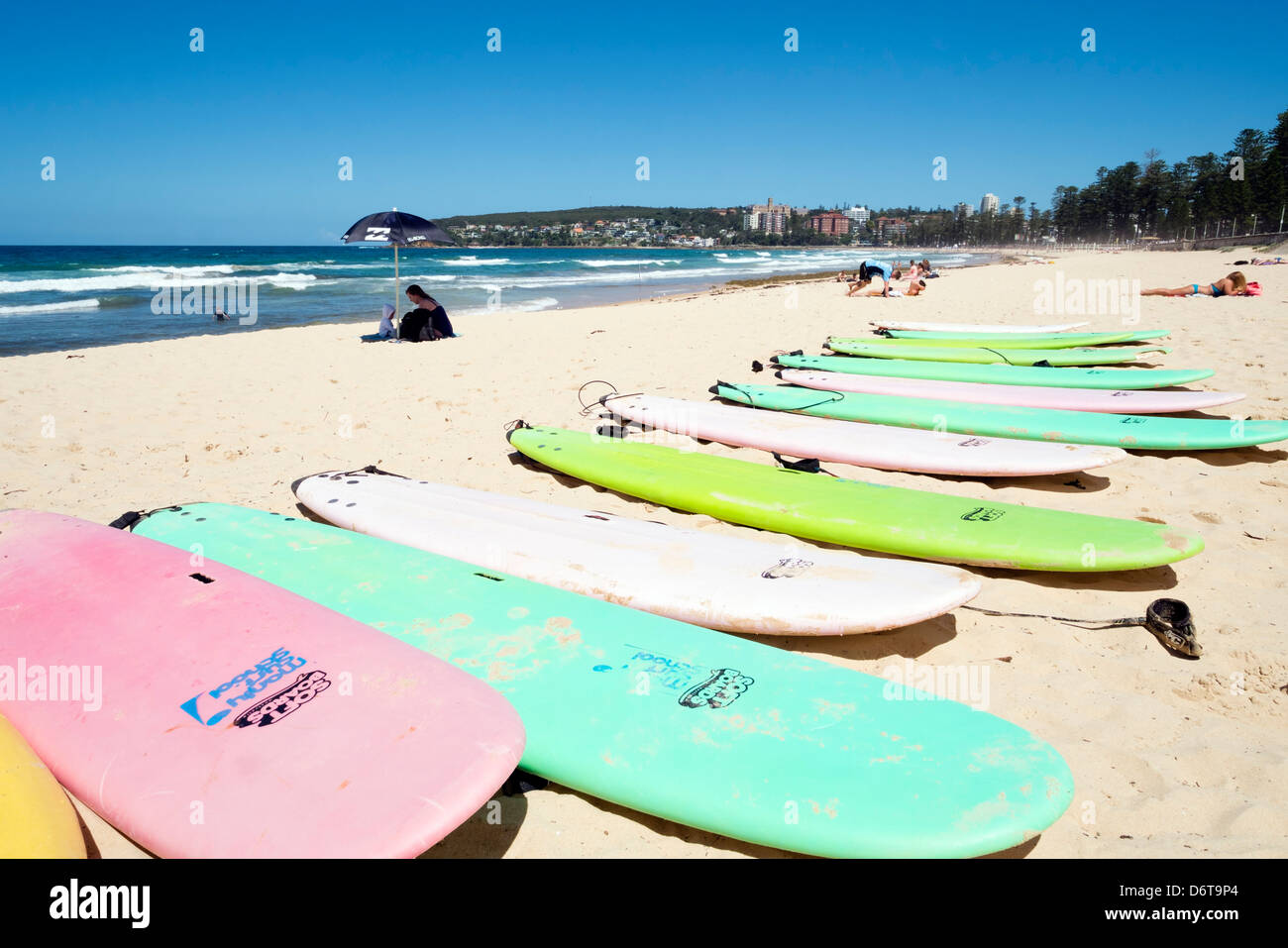 Surfboards lined up on beach at Manly Beach in Australia Stock Photo