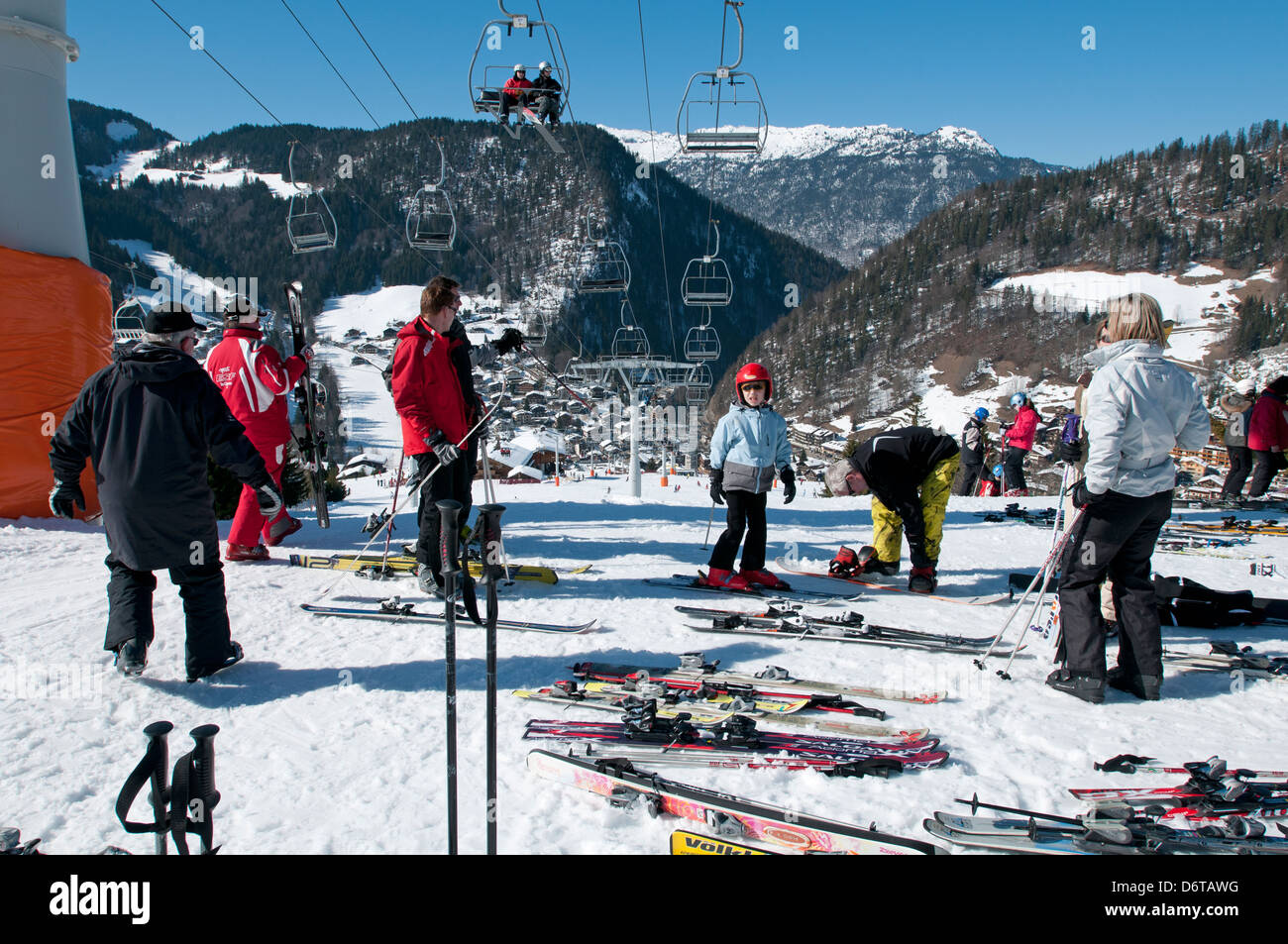 Families stop for lunch at a mountainside restaurant in La Clusaz resort in the French Alps Stock Photo