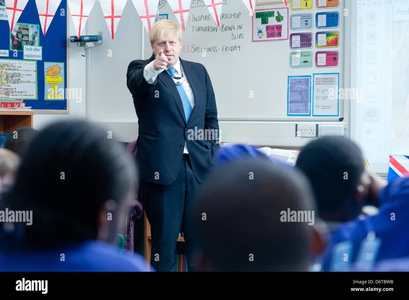 London, UK. 23rd April, 2013. The Mayor of London Boris Johnson visits Tidemill Academy in south London where he joins pupils of the Bonsai classroom (aged 10-11) for a special class to mark St George's Day. Credit: Piero Cruciati/Alamy Live News Stock Photo