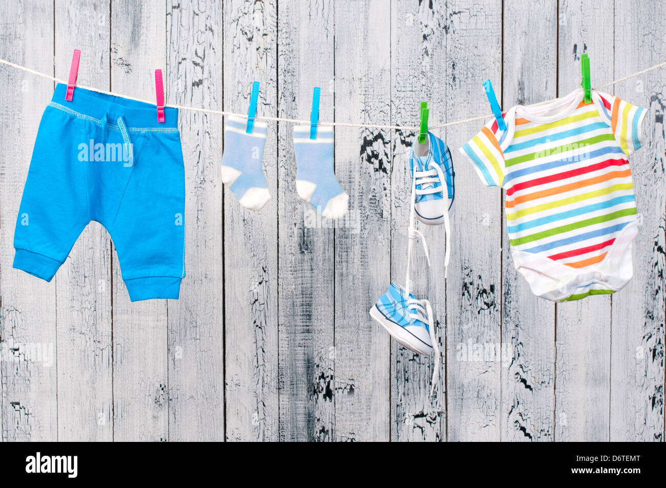 Baby clothes hanging on the clothesline Stock Photo Alamy